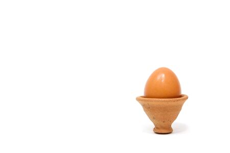 Eggs in a clay pottery on white background