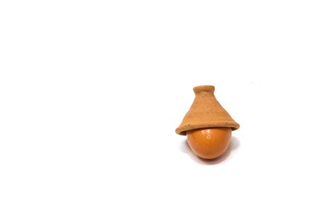 Eggs in a clay pottery on white backgroundの写真素材