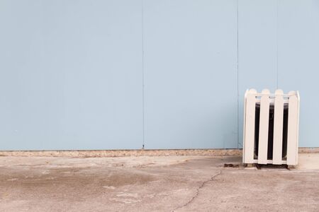 Old cover trash on the blue wallの写真素材