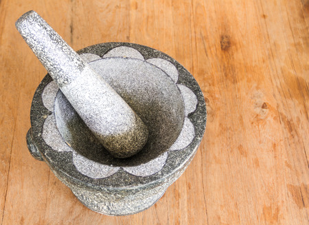 Granite Mortar and Pestle on woodの写真素材