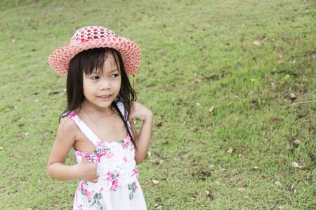 Little asian girl playing in the parkの写真素材