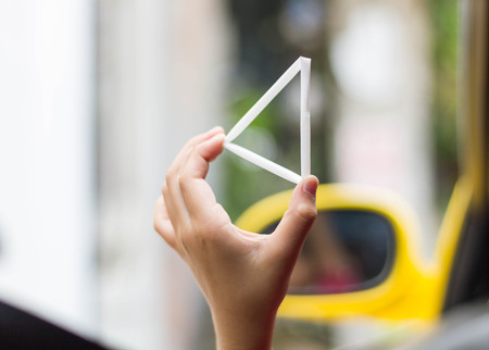 The triangle white straw in children's handの写真素材