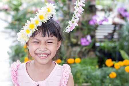 Portrait of happy joyful smiling beautiful little asian kidの写真素材