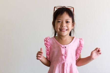 Asian girl kid is funny and smilingの写真素材