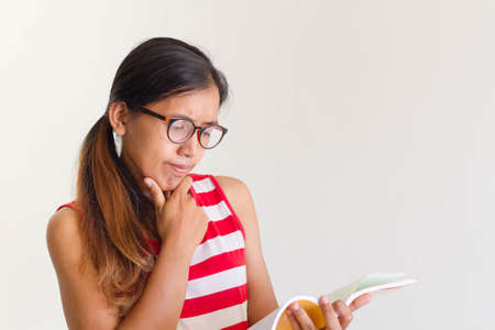 Asian woman reading a bookの写真素材