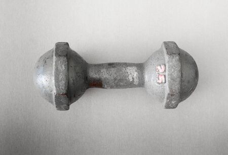 Gray dumbbell 2.5 kilogram on the wood - Vintage Filter Effectの写真素材