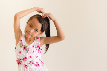 Asian girl kid is expressions of loveの写真素材