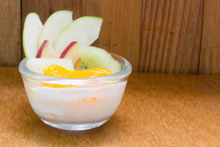 Fresh fruit tart on wooden backgroundの写真素材