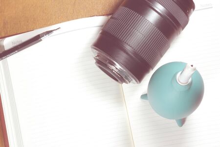 Camera photo lens on notebook ,concept photography  - Vintage effect style picturesの写真素材