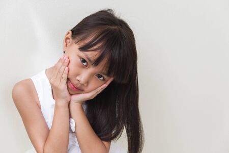 Beautiful little asian girl  isolated in whiteの写真素材