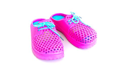 Colorful of pink rubber sandals on a white background
