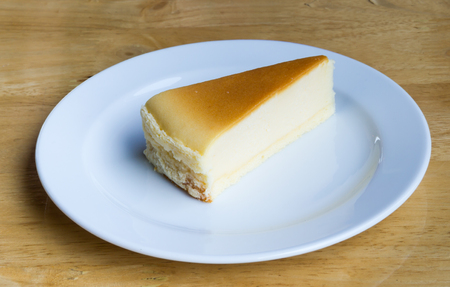 Cheesecake with dish on wooden backgroundの写真素材