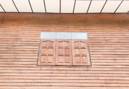 Window with brown orange old wood textureの写真素材