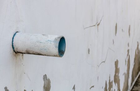 Old stone walls with pipe for texture backgroundの写真素材
