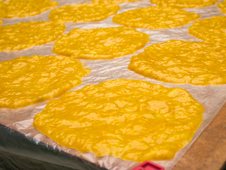 mango sheet (dried mango paste) on plastic for sunburn.の写真素材