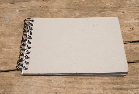Blank paper on the wooden. View from above
