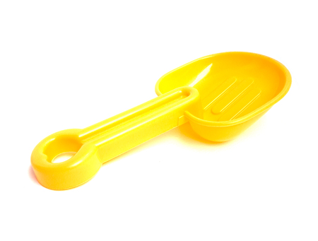 Yellow Spoon beach toys isolated on white background. Color toys. Beach toys. Isolated toys.Children toys.の写真素材