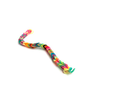 Rainbow loom, Colored rubber bands for weaving accessories isolate white background
