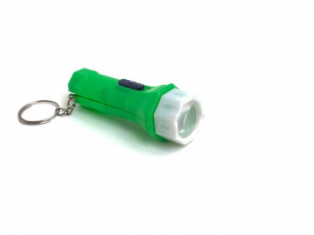 Green flashlight toys isolated on white background. Toys usefulの写真素材