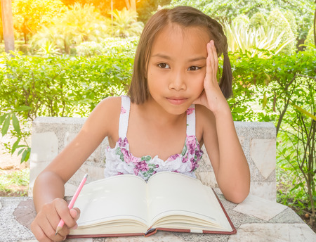 Student asian children with her notebook for learning,Education Concept.の写真素材