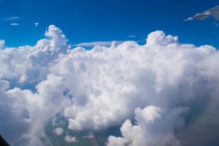 Beautiful cloudy sky abstract background concept related idea. View from airplane windowの写真素材