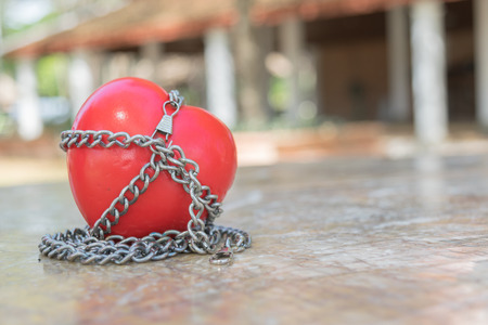 Red heart tied with chains, Valentine Concept.の写真素材