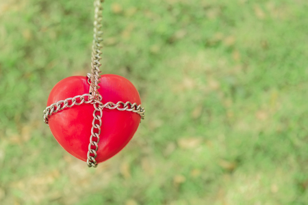 Red heart tied with chains, Valentine Concept.の写真素材