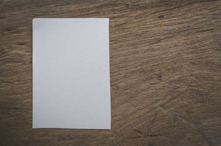 White paper note on the old wooden for background. Concept copy space background.の写真素材