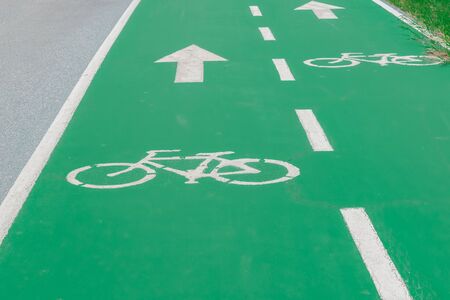 Sign of bicycle on green road. Concept traffic sign.の写真素材