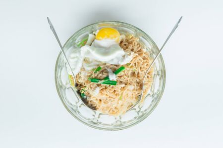 Close up spicy noodle with big egg. Concept food.の写真素材