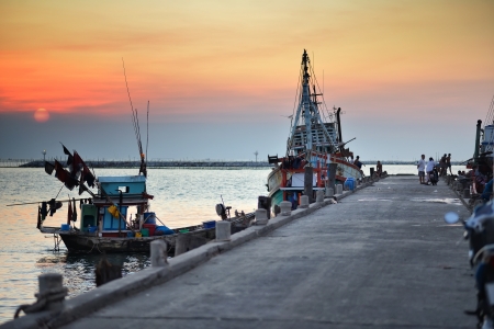Fishing boats at sunset の写真素材