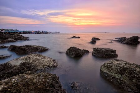 Long exposure photo of beach in the eveningの写真素材