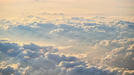 Sunset sky with orange colored clouds.
