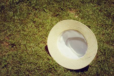 White hat on grassの写真素材