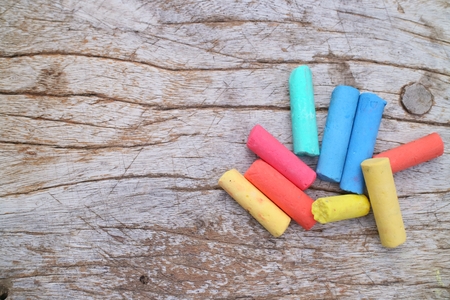 Colored Chalk on old wood backgroundの写真素材