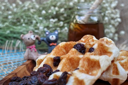 Raisin Waffle on wooden platesの写真素材