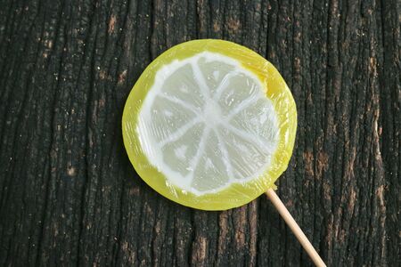 Colorful candies on wooden backgroundの写真素材