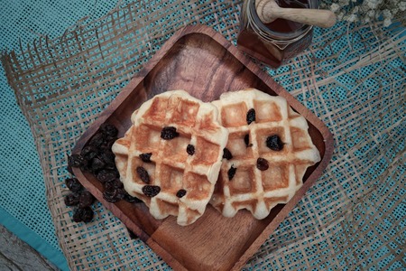 Raisin Waffle on wooden platesの写真素材