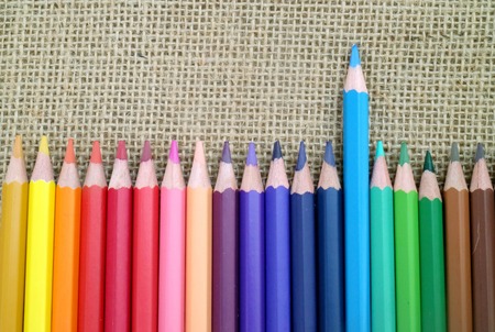 colored pencils on sackcloth backgroundの写真素材