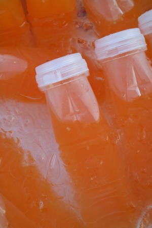 Orange juice bottle  ice coldの写真素材