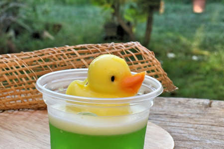 yellow duck jelly on wooden plates , delicious dessertの写真素材