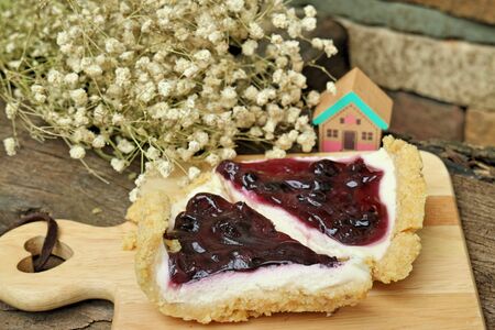 Blueberry cheese cake on wooden platesの写真素材