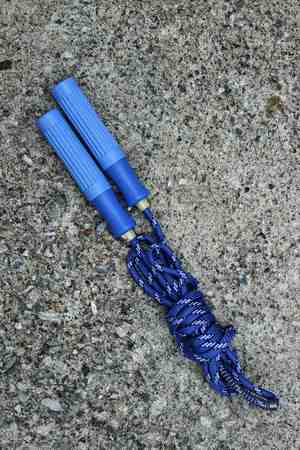 skipping rope for an exercise on cement floorの写真素材