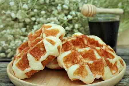 waffle and chocolate sauce on wooden platesの写真素材