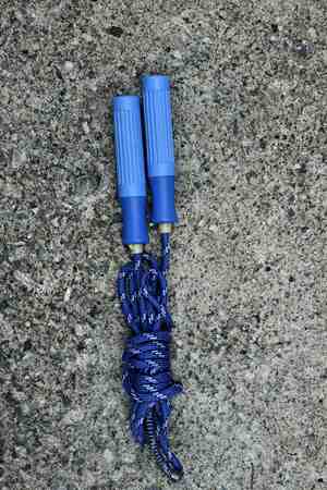 skipping rope for an exercise on cement floorの写真素材