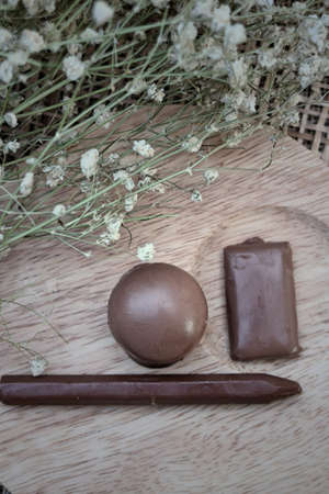 Chocolate sweet on wooden plates