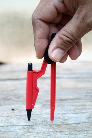 compasses red on wooden backgroundの写真素材