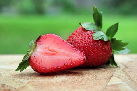 Fresh and ripe strawberries on a wooden backgroundの写真素材