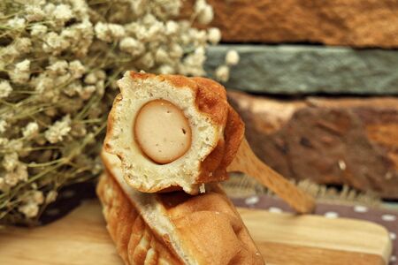 Waffle hotdog on wooden  plates