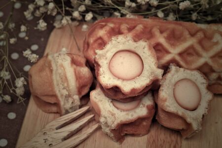 Waffle hotdog on wooden  platesの写真素材